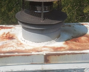 Rusted chase covers cause water leaks in chimneys